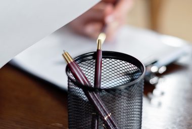 pen in cup on notary public desk