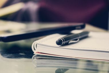pen on notebook on notary public desk