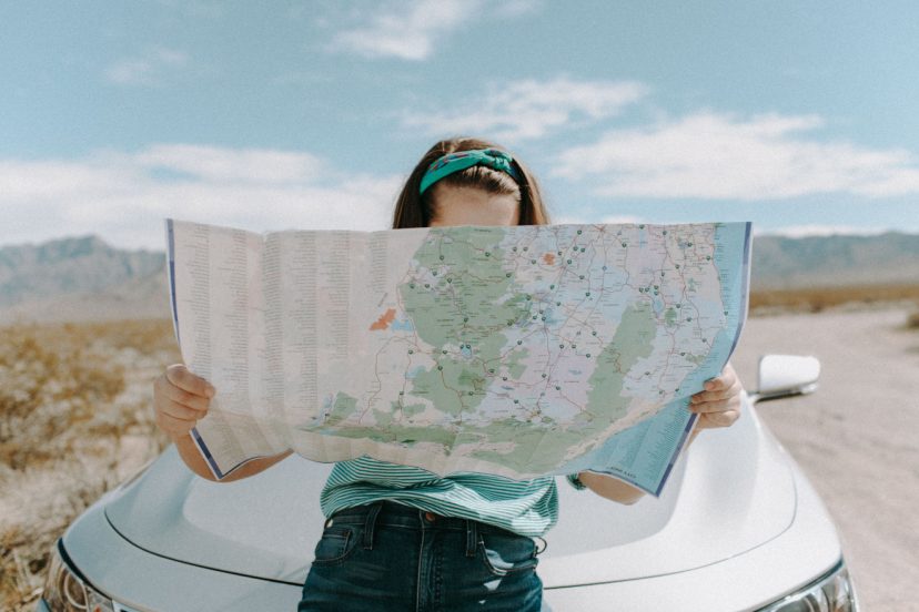reading map outside of car looking for notary public