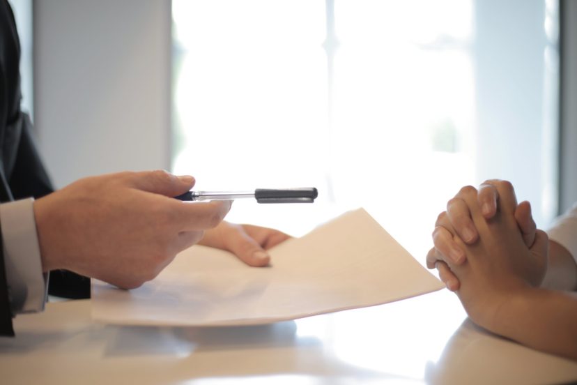 discussing paperwork with notary public