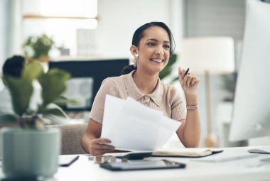 Woman reviewing line 10100 on tax return in office